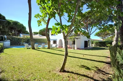 a living room with a couch and a table at Perfect Retreat Overlooking Pinhal Golf Course, Private pool, Off-street parking in Loulé