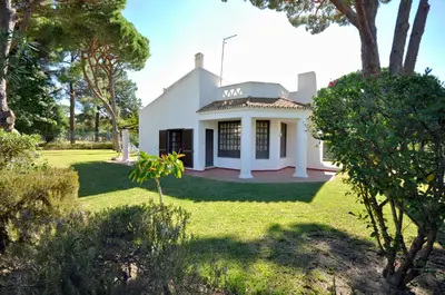 a villa with a swimming pool in front of a house at Perfect Retreat Overlooking Pinhal Golf Course, Private pool, Off-street parking in Loulé