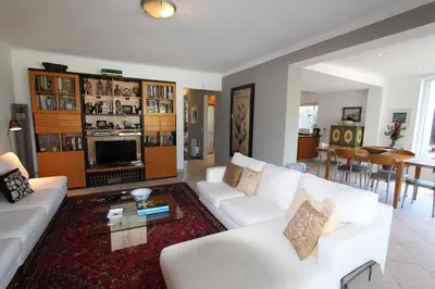 a living room with a white couch and a table at Villa Bonito 56 - Clever Details in Vilamoura