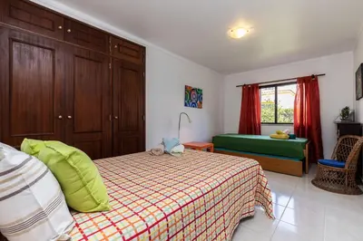 a small bedroom with a bed and a window at Akisol Olhos de Agua Pine II in Albufeira