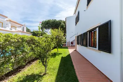 a view of the courtyard of a house with a garden at Akisol Olhos de Agua Pine II in Albufeira