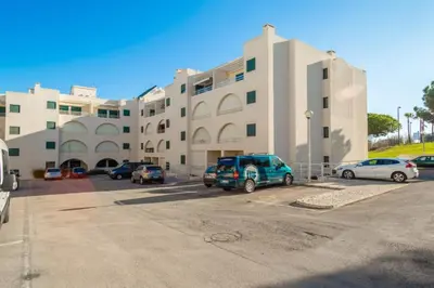 a parking lot in front of a large building at Akisol Albufeira Guia II in Guia