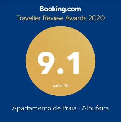 a yellow circle with the text travel review awards at Apartamento de Praia - Albufeira in Albufeira