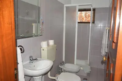 a bathroom with a toilet and a sink at Villa Paraiso - 4 Bedrooms and pool in Albufeira