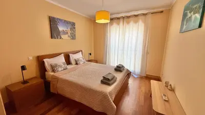a bedroom with a bed with two towels on it at Villa Corcovada Vitória with private pool in Albufeira