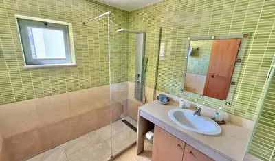 a bathroom with a toilet and a sink at Villa Corcovada Vitória with private pool in Albufeira