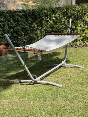 a chair sitting on the grass in the yard at Algarvila in Vilamoura
