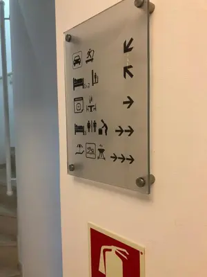 a sign on a wall with symbols on it at Algarvila in Vilamoura