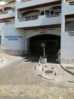 a building with a parking lot with a garage at Apartamento Varandas do Mar, Praia dos Pescadores, Albufeira in Albufeira