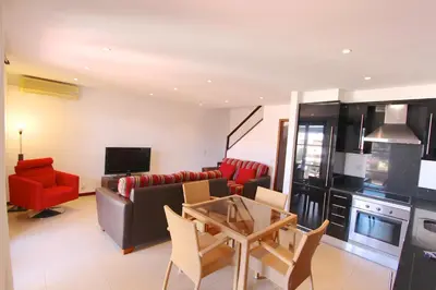 a living room with a couch and a table at Vilar do Jardim 59 - Clever Details in Vilamoura