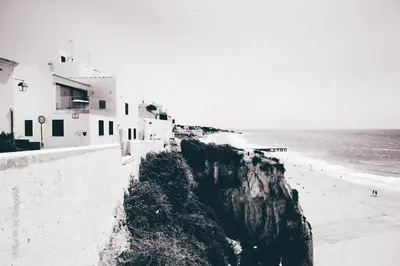 a black and white photo of a beach and buildings at Casa do Sal in Albufeira
