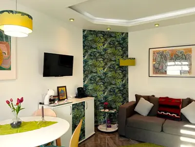 a living room with a couch and a table at Little Wonder Apartment in Albufeira