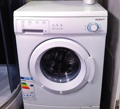 a white washer and dryer in a room at Little Wonder Apartment in Albufeira