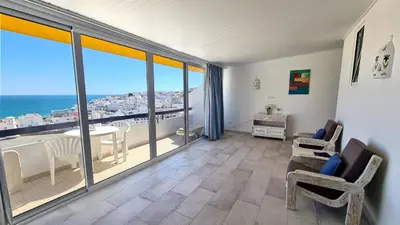 a living room with a view of the ocean at Albufeira, vista mar (63) in Albufeira