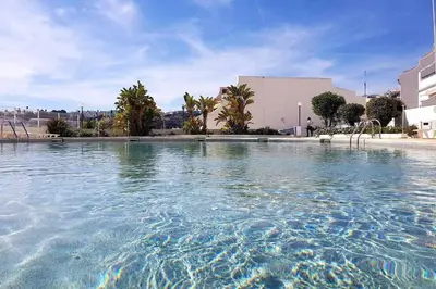 a large pool of water in front of a building at Albufeira, vista mar (63) in Albufeira