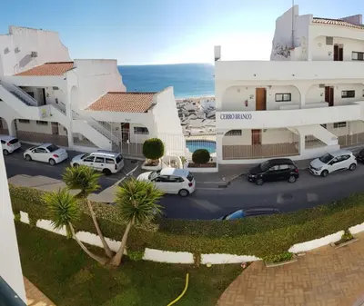 arial view of a parking lot in front of a building at Apartamento Correia in Albufeira