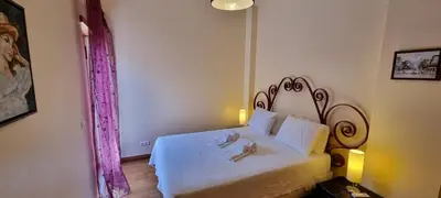 a bedroom with a white bed in a room at Albufeira Marina Villa 27 in Albufeira