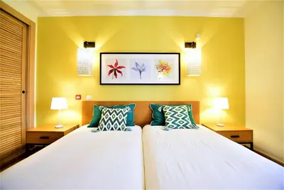 a bedroom with two beds and two lamps at T3 Vila Sol Village in Quarteira