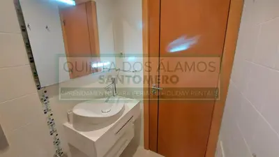 a bathroom with a toilet and a sign on the wall at Moradia Townhouse Vila Rosal 2 in Albufeira