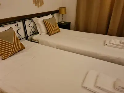 two beds sitting next to each other in a hotel room at Aldeia do Golf - Vila I4 in Vilamoura
