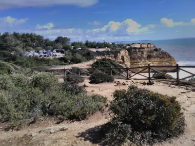 a view of a beach with a bridge and the ocean at Wonder Villa in Albufeira