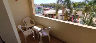 a balcony with two chairs and a view of a city at Bellavista Tenis Clube A4 T1 - Albufeira INN in Albufeira