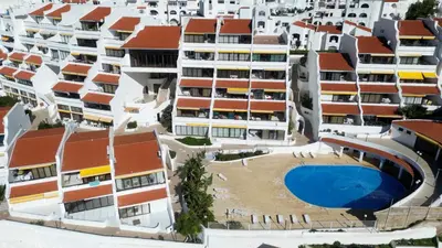 an aerial view of apartment buildings with a swimming pool at Albufeira Cerro Branco (23) in Albufeira