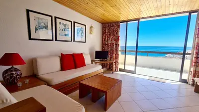 a living room with a couch and a view of the ocean at Albufeira Cerro Branco (23) in Albufeira