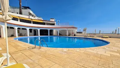 a large swimming pool on the side of a cruise ship at Albufeira Ocean view (62) in Albufeira