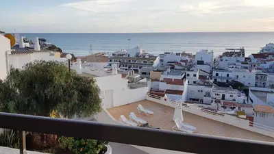 a view of a city from a balcony with the ocean at Albufeira sea view (52) in Albufeira