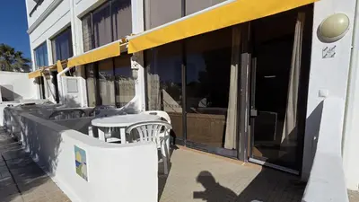 a row of tables and chairs outside of a building at Albufeira, Cerro Branco (42) in Albufeira
