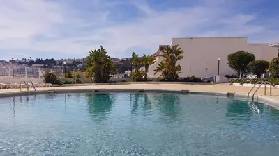 a large pool of water in front of a building at Albufeira, Cerro Branco (42) in Albufeira