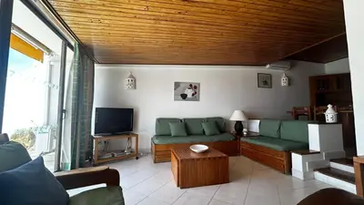 a living room with a couch and a tv at Albufeira, Ocean terrace (22) in Albufeira