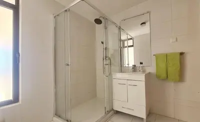 a white bathroom with a shower and a sink at Albufeira, Sea Balcony (11) in Albufeira