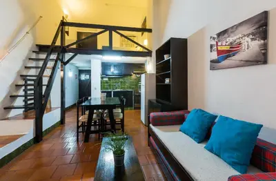 a living room with a couch and a table at Apartamentos Azul Mar in Albufeira