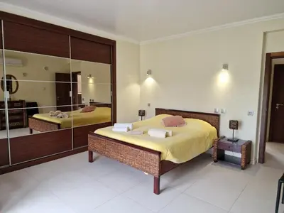 a bedroom with two beds and a large mirror at Quinta Sabaudia in Gateiras