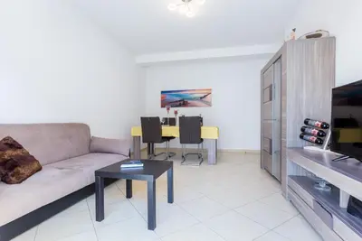 a living room with a couch and a table at Ouranascente in Albufeira