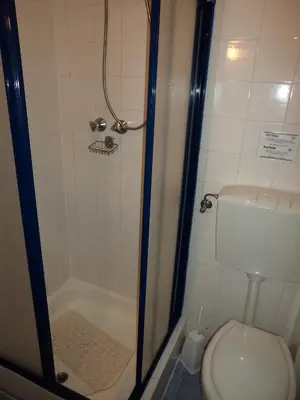 a bathroom with a shower and a toilet at VilaBranca in Albufeira