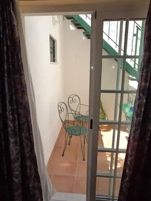 a view of a room with a table and chairs at VilaBranca in Albufeira