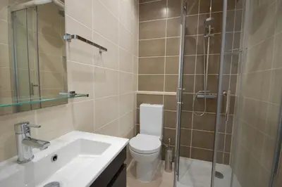 a bathroom with a shower and a toilet and a sink at Apartamento Velamar - 250 m from the Beach by Bedzy in Albufeira