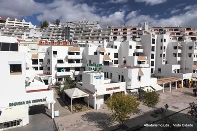 an aerial view of a city with white buildings at Edificio Albufeira Apartamentos A. Local - Albuturismo Lda in Albufeira