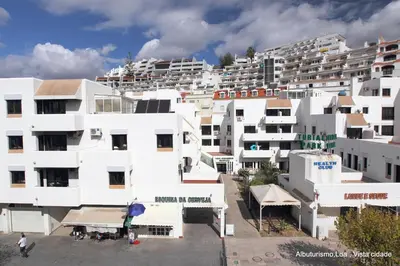 an aerial view of a city with white buildings at Edificio Albufeira Apartamentos A. Local - Albuturismo Lda in Albufeira