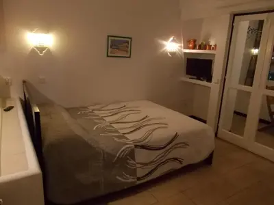 a bedroom with a bed in a room with a window at Bellavista Studio in Albufeira