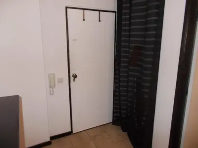 a white door with a handle in a room at Bellavista Studio in Albufeira