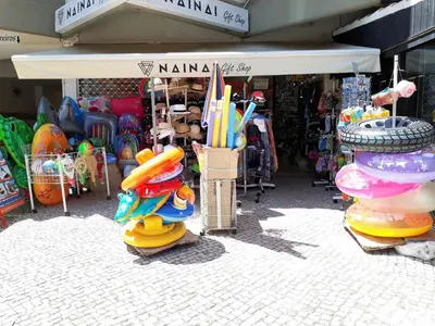 a store with a bunch of toys and umbrellas on display at Sol Nascente- Piscina, Wifi, Familiar in Vilamoura