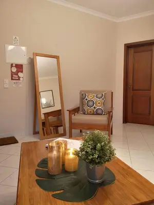 two bottles of wine on a table with a welcome sign at Kiss - Apartamentos in Albufeira