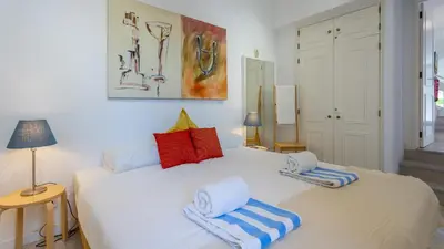 a bedroom with two beds with towels on them at 3 Bed Holiday Home Lakeside Village Quinta Do Lago in Faro
