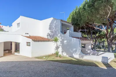 a white house with a staircase in front of it at FLH Albufeira Açoteias Apartment in Albufeira