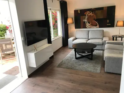 a bedroom with two beds and a window at Beach Villa Vale do Lobo in Vale do Lobo
