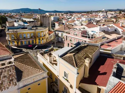 an aerial view of a city with buildings at Casa Beny 1897 Guesthouse in Loulé